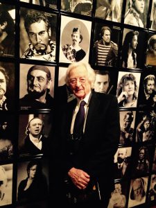 Laurent Stern in 2015 with Louis Mélançon's photo of bass singer Dezső Ernster in the costume of Sparafucile (Rigoletto) at the Permanent Photo Gallery of the New York Metropolitan Opera.